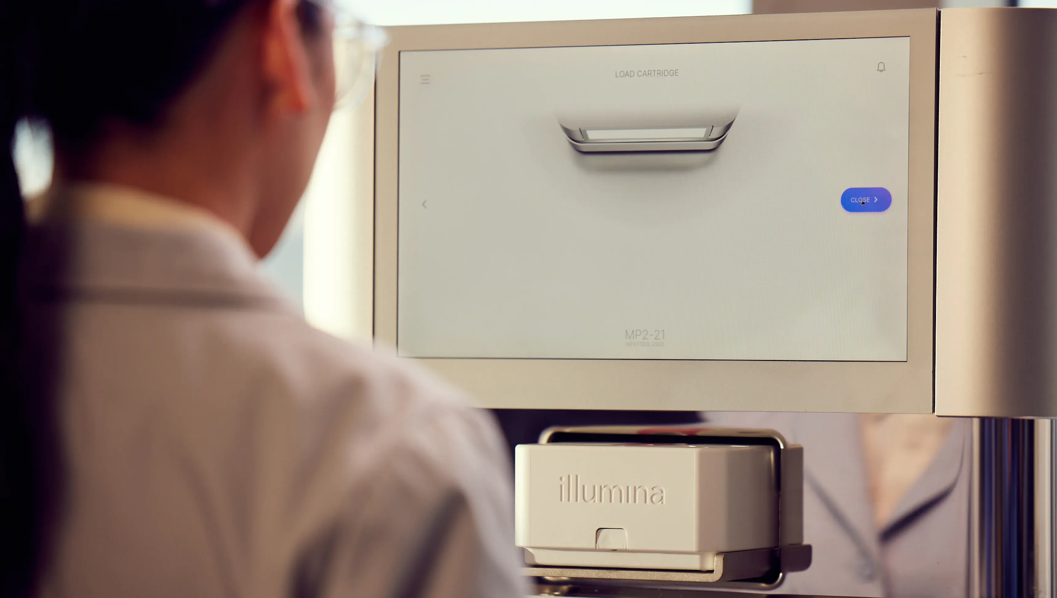 Lab worker with Illumina NextSeq 2000