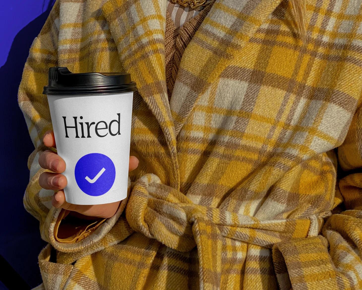 Woman holding a snagajob cup